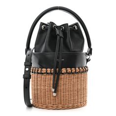 This is an authentic SAINT LAURENT Calfskin Wicker Small Bahia Bucket Bag in Black. This classic hobo bag is crafted of rich black calfskin leather and wicker. The bag features an optional shoulder strap and an optional handle. The top cinch cord opens to a spacious black leather interior. Quilted Toys, Gold Sand, Saint Laurent Bag, Wallet Chain, Black Cross Body Bag, Chain Bags, Leather Interior, Hobo Bag, Camera Bag