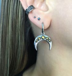 Two toned Moon phase hoops are made of 316L Stainless steel . Moon is detachable, can wear as simple hoop. Size of earrings 1 1/4 inches (from edge to edge) Moon width: 7/8 inches Hoop inner diameter: 10mm Post :0.8mm / 21G (regular post) Ships in a gift box Sterling Silver Crescent Cartilage Earrings With Moon Charm, Celestial Moon-shaped Pierced Cartilage Earrings, Celestial Moon Shaped Pierced Cartilage Earrings, Celestial Crescent Cartilage Earrings, Black Moon Jewelry With Sun And Moon Design, Black Moon-shaped Jewelry With Sun And Moon Design, Bohemian Crescent Hoop Earrings With Moon Charm, Black Moon-shaped Sun And Moon Jewelry, Silver Crescent Plug Earrings