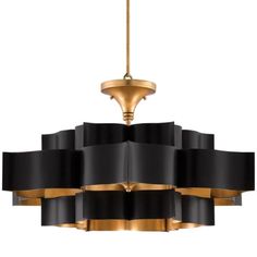 a black and gold chandelier hanging from a ceiling fixture with an elegant design