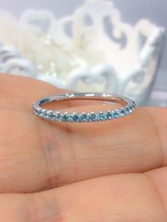 "Delicate 18 K Solid White Gold Half Eternity Band Ring with Natural Aquamarine Gemstones. This Ring is Full of Elegance and Beauty! It is so Simple and so Complete at the same time! One can wear this band alone by itself or match it with Engagement Solitaire Ring to make a Wedding Set (Bridal Set). These Rings are also called Stacking Rings, because you can stack as many rings together as you wish, mix and match colors and styles to your taste. Material: 18K Solid White Gold Setting Type: U Mic Blue Eternity Band For Wedding, Blue Cubic Zirconia Eternity Band For Wedding, Blue Diamond Half Eternity Ring For Wedding, Blue Half Eternity Stackable Rings For Anniversary, Blue Eternity Band Promise Ring, Blue Half Eternity Diamond Ring For Wedding, Blue Half Eternity Band Promise Ring, Blue Half Eternity Band For Promise Ring, Blue Round Eternity Band For Wedding