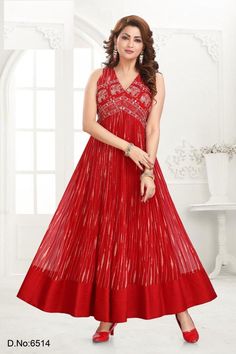 Dazzle in this stunning red Anarkali kurti, featuring exquisite gold print and intricate embroidery on the bodice. The V-neckline and sleeveless design add a contemporary touch to this traditional silhouette, making it perfect for festive occasions, weddings, and special events. The flowy, pleated skirt enhances the elegance and grace of the outfit, ensuring a flattering fit for all body types. Crafted from high-quality fabric, this kurti provides comfort and style, making you stand out in any crowd. Pair it with matching accessories and footwear to complete your glamorous ethnic look. Available in various sizes. V-neck Anarkali Set For Diwali, Sleeveless Anarkali Set With Zari Work For Navratri, Sleeveless Anarkali Set For Navratri With Pallu, Navratri Reception Sleeveless Gown, Bollywood Style Sleeveless Dress With Cutdana, Bollywood Sleeveless Dress With Cutdana, Sleeveless Gown For Navratri Reception, Sleeveless Reception Gown For Navratri, Sleeveless Georgette Salwar Kameez For Navratri