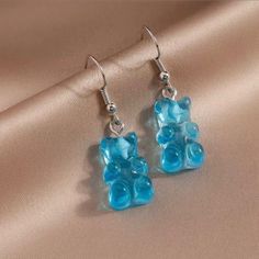 Blue Candy Gummy Bear Dangle Earrings New With Tags Size: One Size Color: Blue & Silver Candy Gummy Bear Dangle Earrings. 1 Pair. Colorful. Lightweight. Made Of Resin & Alloy. Perfect For Everyday Wear Measurements: 3.7cm X 1.2cm Add To Your Collection Today No Trades No Modeling Use The Offer Button 15% Off 2 Or More Items Free Gift With Every Order Same Day / Next Day Shipping Candy Gummy, Candy Boutique, Tory Burch Earrings, Blue Candy, Turquoise Drop Earrings, Swirl Earrings, Gummy Bear, Holiday Jewelry, Sterling Silver Cross