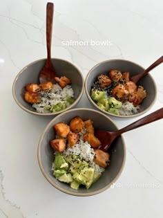 three bowls filled with different types of food on top of a white countertop next to wooden spoons