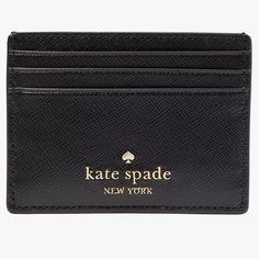 a black card case with the name kate spade on it and a gold - plated logo