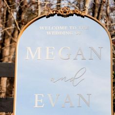 a sign that says welcome to the wedding of megan and evan