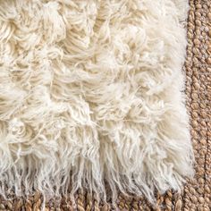 a close up view of a shaggy rug on the floor