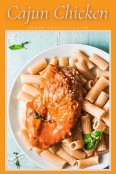 chicken parmesan with sauce and pasta on a white plate next to the words cajun chicken