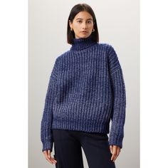 Blue knit (3% Wool, 51% Acrylic, 46% Polyester). Sweater. Long sleeves. Turtleneck. Pull on. 22.5" from shoulder to hemline. Imported. Blue Sweater With Ribbed Collar For Work, Blue Oversized Turtleneck Top, Oversized Blue Turtleneck Top, Blue Ribbed Collar Top For Fall, Blue Knitted Top With Relaxed Fit, Blue Relaxed Fit Sweater For Work, Blue Knitted Turtleneck Top, Polyester Sweater, Loose Knit Sweaters