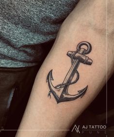 an anchor tattoo on the arm