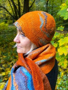 Autumn felted women's hat handmade from delicate Australian Merino wool in shades of orange with a touch of turquoise. The hat is hand felted, it is seamless and durable. The hat is decorated with viscose and lyocell fibers, it has an unusual and interesting texture. The edge of the cap is neatly stitched on the inside. The hat is very soft and pleasant to the touch, light, warm and breathable. To create my products I use only natural materials and the finest merino wool, so my products do not p Felted Hat, Fall Hat, Orange Hat, Hat Aesthetic, Orange Hats, Fall Hats, Hat Handmade, Handmade Hat, Hand Felted