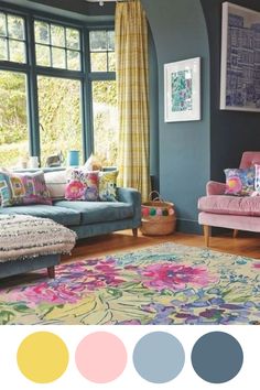 a living room filled with furniture and lots of window sill space next to a colorful rug