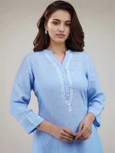 The very beautiful hand embroidered Linen-cotton tunic or kurta, available on demand (made to order) and customizable.Sizing: Please refer to our Size Chart to find your sizeThe item features55% Linen 45% CottonRound mandarin like collar with V slitLong tunic for culottes, leggings or pants3/4 sleevesAverage length (short): 32 in; Length customizableAverage length (long): 45 in; Length customizableLength of product may slightly vary as per the sizes. Please note: smaller size may be slightly sho Blue Traditional Kurta With Embroidered Neckline, Traditional Blue Kurta With Embroidered Neckline, Long Sleeve Linen Kurta With Chikankari Embroidery, Blue Embroidered Straight Kurta Top, Traditional Linen Tops With Chikankari Embroidery, Blue Floral Embroidered Tunic Kurta, Traditional Long Sleeve Tunic With Embroidered Hem, Embroidered Hem Tunic Kurta, Traditional Cotton Tunic With Embroidered Neckline