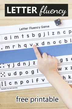 a hand is pointing at the letters on a blue and white printable letter fluence