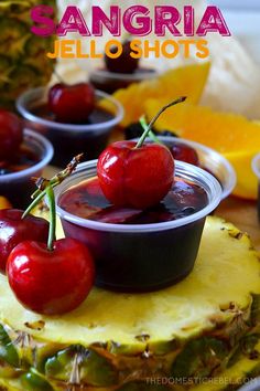 there are cherries on top of the pineapples and in bowls with sauce