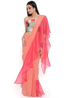 Peach georgette 3D floral embroidered choli and peach georgette saree with coral organza ruffle pallu. Disclaimer: Since we are a made-to-measure brand and our dyeing process and embroidery are handcrafted, there may be slight variations in the color and embroidery of the actual product. The print placement may also vary from what is represented in the images shown on the product page. Summer Georgette Pre-draped Saree For Reception, Fitted Chiffon Saree With Ruffles, Semi-stitched Georgette Choli With Ruffles, Summer Georgette Saree With Ruffles, Chiffon Saree With Ruffles In Traditional Drape, Ruffled Chiffon Saree In Traditional Drape, Summer Wedding Saree With Ruffles, Wedding Chiffon Saree With Ruffles, Diwali Georgette Dupatta With Ruffles