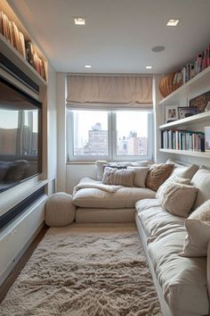 a living room filled with lots of furniture and bookshelves next to a window