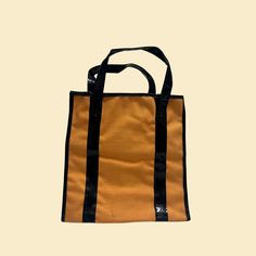 "Vintage mini tote bag, manufactured ca. 1970s. Unmarked brand with an orange and black color scheme.     - Brand: Unmarked.    - Size: 8.75\" (length) x 9.25 (height) x 3.5\" (width); 4.5\" hang length    - Time Period: 1970s    - Color(s): Orange, black    - Materials: Polyurethane-like material & nylon/plastic of some type (faux leather)    - Made in: Japan    - Condition: Fair to good, vintage condition with minor/light markings throughout (clear in close-up photos).  We offer free shipping Orange Canvas Tote Bag For Everyday Use, Retro Black Canvas Travel Bag, Retro Black Canvas Bag For Travel, Retro Orange Shoulder Bag For Everyday, Everyday Use Orange Canvas Tote Bag, Black Retro Canvas Bag For Travel, Retro Orange Shoulder Bag For Daily Use, Rectangular Orange Canvas Bag For Everyday Use, Orange Rectangular Canvas Bag For Everyday Use