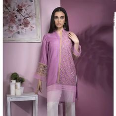 Straight Kurta This Unique Raw Silk Look Features A Dash Of Sheer Accents And A Whole Lot Of Embroidered Detailing.Embroidered Front, Plain Back, Full Sleeves, Ban Neck With Placket Festive Long Sleeve Purple Top, Elegant Embroidered Purple Kurta, Elegant Purple Embroidered Kurta, Purple Zari Work Blouse For Eid, Purple Long Sleeve Kurta With Dupatta, Festive Purple Tops With Resham Embroidery, Purple Long Sleeve Kurta With Zari Work, Purple Resham Embroidery Long Sleeve Sets, Purple Sets With Resham Embroidery And Long Sleeves