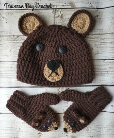 a crocheted bear hat and mittens are shown