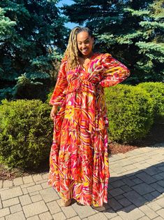 This stunning long sleeved tiered maxi dress is feminine and fabulous. Rock the Nicolette Maxi on vacation, to a wedding or your next special event and feel like a goddess. This dress effortlessly transitions to fall by styling it with boots! This dress has impeccable style and quality. Lined. Color: Burnt orange/fuchsia/multi Sizes: 1X fits sizes 12/14 (as shown on size 10/12 model) 2X fits sizes 16/18 3X fits sizes 20/22 Boot Color With Burnt Orsnge Dress, Curvy Maxi Dress, Dress Curvy, A Goddess, Curvy Dress, Tiered Maxi Dress, Skirt Leggings, On Vacation, Cardigan Jacket