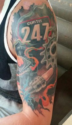 a man with a tattoo on his arm that says curtis 24 and has gears in the background