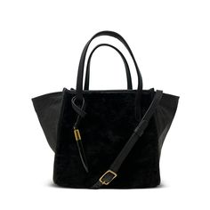 Our Mini Tote in black shearling and soft black leather mix is the epitome of subtle luxury. Small, discreet, silent, it's only on second looks that this bag reveals its sublime quality, richness and stealthy wealth appeal of cuddly lambskin and butter soft leather. Dressed up, or dressed down, handheld, or worn crossbody, but always with our signature toggle, this bag has so much attitude it's going to be hard for others to keep their hands off you. Everyone's going to want to touch this bag. W Black Suede Bag For Formal Occasions, Elegant Evening Shoulder Bag With Faux Fur Lining, Elegant Evening Bags With Faux Fur Lining, Timeless Textured Black Leather Bags, Black Leather Bag With Suede Lining, Everyday Black Suede Shoulder Bag, Black Suede Bags For Daily Use, Timeless Black Textured Leather Satchel, Elegant Rectangular Shoulder Bag With Faux Fur Lining