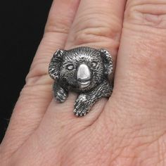 This Koala Bear Ring is a beautiful example of my Animal Jewelry line. This cute koala hugs your finger and smiles. This silver ring will make a great gift for her or him. Highly detailed sculptural work - you can see every detail down to the tiny claws. This ring was first carved in wax then cast in sterling silver to replicate. Patina was added here to highlight the fur texture and other details. See the process here: https://youtu.be/SGv9FLAb8Ws See this ring with black diamond eyes: https:// Koala Jewelry, Koala Art, Nails Rings, Bear Ring, Cute Koala Bear, Koala Bears, Cute Koala, Animal Ring, Fur Texture