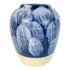 a blue and white vase sitting on top of a table