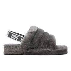 The UGG Kids Fluff Yeah Slide is both comfortable and makes a statement in its design. The soft sheepskin upper wraps the entirety of the foot to provide a comfortable and warm experience. A rubber outsole is placed underneath the silhouette to prevent slipping and further enhance the integrity of the slide. The signature UGG logo woven label placed at the sock liner completes the design. Sheepskin upper Fleece lining Molded rubber outsole UGG logo woven label Grade school sizing Style No: 10984 Fluff Yeah Slide, Ugg Slides, Ugg Kids, Best Slippers, Baby Nike, Black Slippers, Sheepskin Slippers, Before Midnight, Sheepskin Boots