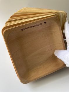 several wooden plates stacked on top of each other with the names of their birthdays