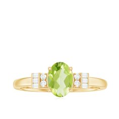 Product Details Graceful and divine, this Peridot Engagement Ring is a classic piece of fine jewelry, artistically crafted in Gold for a perfect and luxurious look. Oval Shape Peridot Ring has Baguette and Round Diamond embellishing the ring from sideways. Make your significant other extremely happy by presenting her with this Peridot Diamond Ring. Product Information SKU SHP-RINGS0821232012 Width 4.3 mm Height 7 mm Weight 2.08 gm (Approximate) PERIDOT INFORMATION No.of Stones 1 Pieces Total Weight 0.65 Carat (Approximate) Dimension(approx) Oval-5X7 mm-1 Pcs Color Green Cut Brilliant Shape Oval Setting Type Prong-Setting Quality Grade AAA DIAMOND INFORMATION No.of Stones 10 Pieces Total Weight 0.10 Carat (Approximate) Dimension(approx) Baguette-1.00X1.50 mm-6 PcsRound-1.40X1.40 mm-4 Pcs Co Peridot Engagement Ring, Peridot Engagement Rings, Classic Engagement Ring, Classic Engagement, Ring With Diamond, Classic Engagement Rings, Peridot Ring, 18k Yellow Gold Ring, Ring Sizer