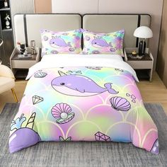 a bed with a colorful comforter and pillows