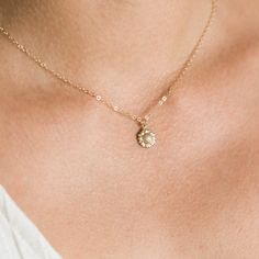 "Our dainty sunflower necklace is our newest addition to our dainty layering necklaces. Sunflowers symbolize adoration, loyalty, and longevity - making it the perfect gift for your loved ones. Available in gold filled or sterling silver. . . . . . . . . . . . . . . . . . . . . . . . . . . . . . . . . . . . . . . . . . . NECKLACE + Length: 16\" + 2\" extender + 14k gold filled -or- sterling silver sunflower 9mm pendant (hollow in back) + 14k gold filled -or- sterling silver spring clasp, jump rin Delicate Adjustable Necklace With Flower Charm, Flower Pendant Charm Necklaces For Weddings, Delicate Flower Pendant Necklace, Delicate Flower Pendant Jewelry With Flower Decoration, Dainty Round Flower Charm Necklace, Dainty Round Pendant Flower Necklace With Flower Charm, Delicate Necklace With Flower Charm And Round Pendant, Delicate Clavicle Chain Necklace For Bridesmaid Gift, Delicate Necklace With Flower Charm