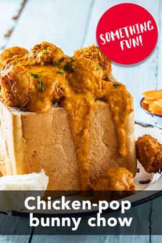 chicken - pop bunny chow on a plate with some fries