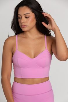 Our Light Magenta Sports Bra Top is such a stunner. Double lined for maximum coverage with removable padding for extra support. The bustier design is ultra-trendy, making this the perfect sports bra for your hardest workout class. Fitted Yoga Bra With Built-in Padding, Contoured Sports Bra With Built-in Padding For Gym, Sporty Contoured Sports Bra With Built-in Bra, Sporty Fitted Bra With Built-in Support, Fitted Sports Bra With Built-in Bra For Gym, Fitted Training Bra With Removable Pads, Fitted Bra With Removable Pads For Pilates, Compressive Bra With Built-in Padding, Functional Gym Bra With Removable Pads