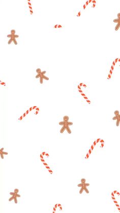 gingerbreads and candy canes on a white background with red and orange stripes