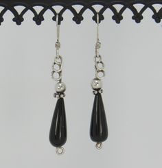 "BE22-Handmade Sterling Silver Earrings with Teardrop Black Onyx and SS Beads. Earrings hang down about 1 3/4\" and have a hand crafted design on top to make them unique. All of my pieces are one of a kind and made by me from start to finish. If you would like more information on my jewelry or me please go to my website at: www.denimanddiamondjewelry.com Thanks for looking! Feel free to contact me with any questions or more info on this piece. Patti" Nickel Free Black Round Bead Earrings, Teardrop Black Beaded Earrings As Gift, Black Beaded Teardrop Earrings For Gift, Teardrop Black Beaded Earrings For Gift, Teardrop Earrings With Black Beads For Gifts, Silver Wire Earrings, Artisan Earrings, Beads Earrings, Casting Jewelry