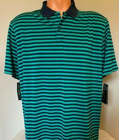 ~ Nike Golf ~ Men's Golf Polo Shirt  Style: 891853 - Color: 370 Navy/Green - Size: Large ~ Brand New With Tags - Retail $65.00 ~ 87% Polyester 13% Spandex Standard Fit  Dri-Fit pulls away sweat to help keep you dry and comfortable Armpit to armpit across measures approx. 26" Armpit to hem approx. 21" Back neck seam to hem approx. 32" I want my buyers to know that customer satisfaction is my Priority!  If you have a problem with your purchase Please contact me and I will do ev Sporty Green Collared Polo Shirt, Green Sporty Shirt For Sports, Green Crew Neck Top For Golf, Green Cotton Golf T-shirt, Casual Green Moisture-wicking Shirt, Green Casual Moisture-wicking Shirt, Green Cotton T-shirt For Golf, Green Casual Shirt With Moisture-wicking, Sporty Collared Green Tops