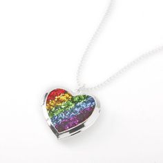 a rainbow heart shaped pendant on a silver chain