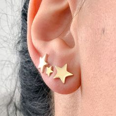 "This precious earring is composed completely of 14K solid gold and comes with matching 14K solid gold secure earring backs. This earring is thick enough for a single initial to be engraved. NOTE: If you wish to customize this item with engraving font please indicate the specific font style desired in the 'Note to Seller' section upon checkout. ♦ Star Dimensions: approximately 8mm (w) x 8mm (h) ♦ Post Thickness: 20 gauge (0.8mm) ♦ Metal Finish: High Shine Polish ♦ This design is available in Ros Tiny Gold Star Cartilage Earrings, Gold Piercings With Star Charm As Gift, Elegant Gold Star Piercings, Gold Star-shaped Dainty Cartilage Earrings, Gold Nickel-free Star Cartilage Earrings, Gold Star Cartilage Earrings Nickel Free, Gold Dainty Star Cartilage Earrings, Dainty Gold Star Cartilage Earrings, Gold Star Cartilage Earrings In Minimalist Style