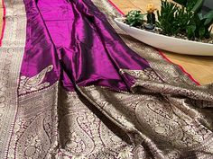 From our festive collection, a pure handwoven Banarasi katan silk kadhuan weave saree in a beautiful shade of  purple.This sare is ready to wear , fall , pico and tassels all finely done. Purple Banarasi Silk Saree With Self Design, Elegant Purple Jamawar Dupatta, Designer Purple Tussar Silk Saree, Designer Purple Tussar Silk Dupatta, Purple Tussar Silk Dupatta For Designer Wear, Purple Jamawar Saree With Cutdana, Purple Katan Silk Saree With Self Design, Purple Jamawar Saree With Self Design, Purple Banarasi Silk Handloom Saree