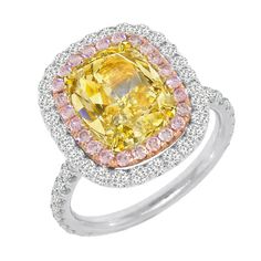 METAL SPECIFICATIONS Multi-Tone Gold 14K STONE SPECIFICATIONS Stone Name : Yellow Canary Diamond, White Diamond, and Pink Sapphire Stone Cut : Cushion and Round Stone Details : This beautiful halo ring has one cushion cut yellow canary diamond in the center approx. 2 carats (Approx. Size 6.5 x 6.5 mm) and approx. 2 carats of round pink sapphires and white diamonds on the sides. Natural earth mined stones. Color : Yellow Canary/Pink/F Clarity : VS1/AAA/VVS1 Quality of Sapphire : AAA Total : Appro Pink Diamond Engagement Ring, Canary Diamond, Yellow Cushion, Ring My Bell, Colored Diamond Rings, Yellow Jewelry, Beautiful Diamond Rings, Diamond Halo Ring, White Diamond Ring