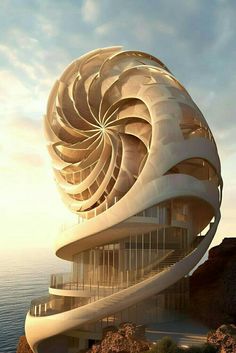 a large spiral shaped building sitting on top of a cliff