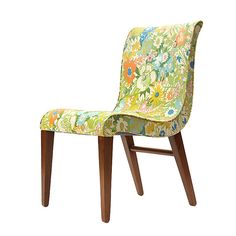 an upholstered chair with wooden legs and floral fabric seat cover on white background