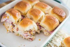 there are many sliders in the pan on the table