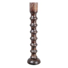 a tall wooden candle holder on a white background