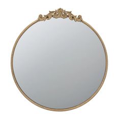 a round mirror with gold trimmings on the edges and an ornate border around it