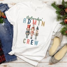 Embrace the holiday season with our admin nutcracker top - a merry blend of festive charm and administrative flair! Crafted from comfortable, high-quality fabric, this cute admin t-shirt brings a touch of yuletide spirit to the workplace. Featuring whimsical Nutcracker-inspired designs, each member of your admin crew is bestowed with a playful and festive nickname, adding a delightful twist to your seasonal work ensemble.  Whether you're organizing office festivities or orchestrating year-end tasks, this shirt embodies the perfect fusion of comfort and holiday cheer. Elevate your administrative team's festive style and celebrate the season with our fun nutcracker admin t-shirt  - where efficiency meets enchantment! * 100% combed and ring-spun cotton (Heather colors contain polyester) * Fab Whimsical Nutcracker, Organizing Office, Seasonal Work, Christmas Funny, Favorite Shirts, Festival Fashion, Christmas Humor, Unisex Shirt, Holiday Cheer