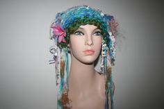 Totally unique! One in the world! Ready To Ship! Soft and fairy-like! Hand Made Freeform knitted forest Mermaid fairy Hat! Unique. One Of A Kind Wearable Art.  Makes a lovely gift! Comes Gift Wrapped! Lovely colours, blue, green, pink, lilac purple and white tones.  You will be the only one in the world to wear this hand made knitted item! Each item that I make is slightly different because it's hand made and colours vary. You will be receiving the actual item in these photos, it's already made Whimsical Handmade Crochet Hat, Whimsical Crochet Hat For Festivals, Whimsical Handmade Crochet Hat For Festival, Whimsical Handmade Crochet Festival Hat, Handmade Whimsical Crochet Hat For Festivals, Whimsical Handmade Multicolor Costume Hats And Headpieces, Bohemian Crochet Mini Hats, Bohemian Yarn Mini Hats, Bohemian Mini Hats In Yarn