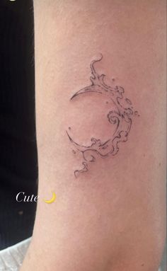 a woman's arm with a tattoo design on the left side of her leg